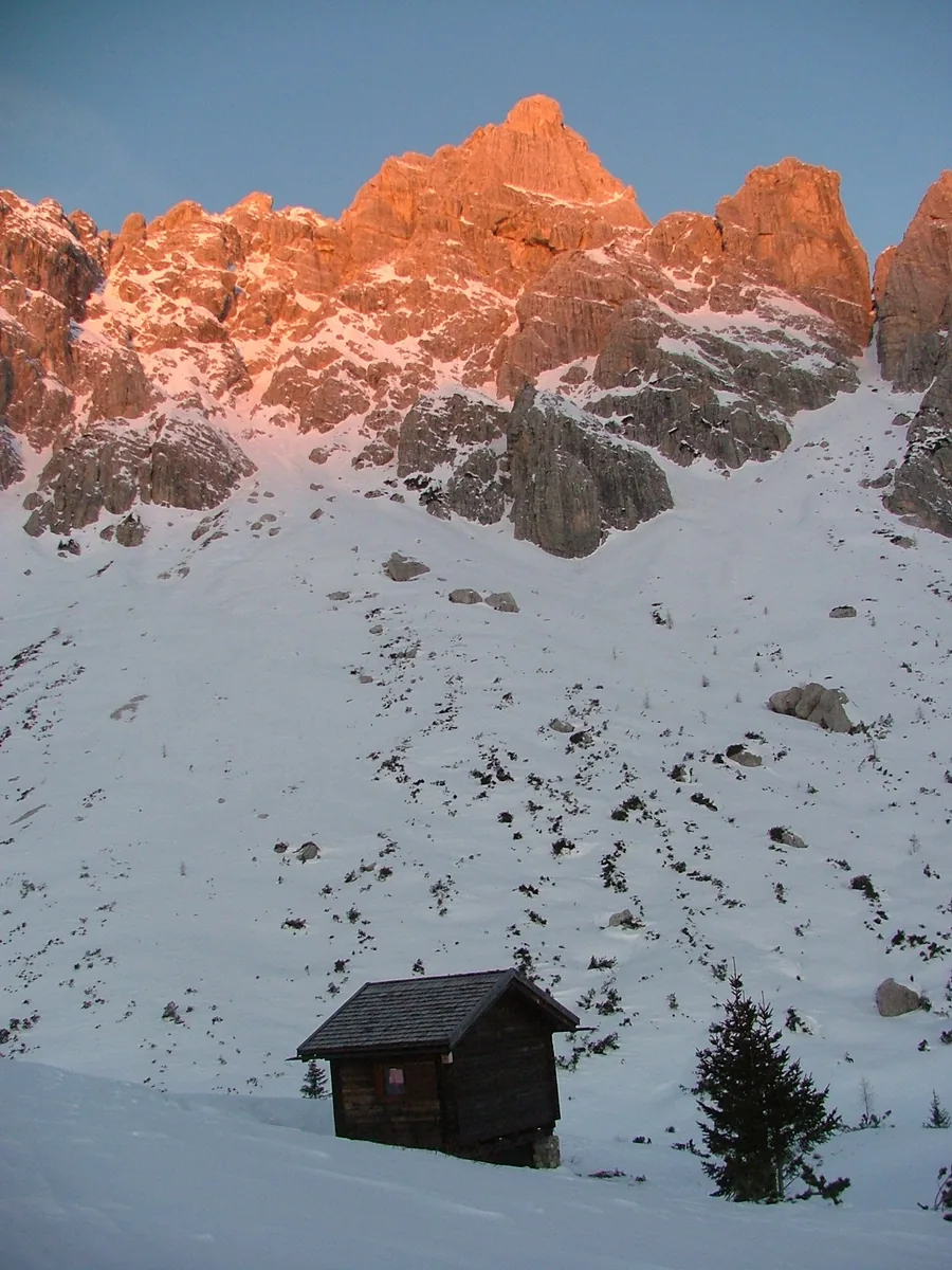 Warm sunrise touching steep mountain walls